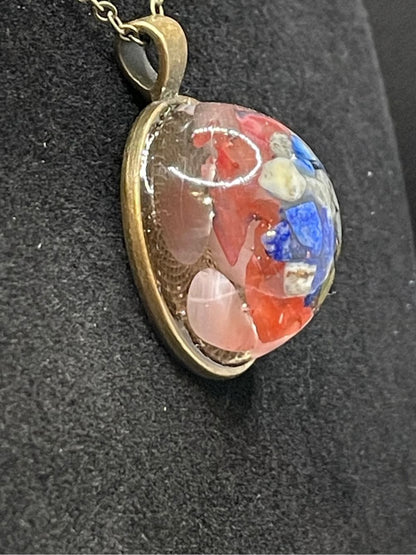 Mineral and abalone shell pendant.