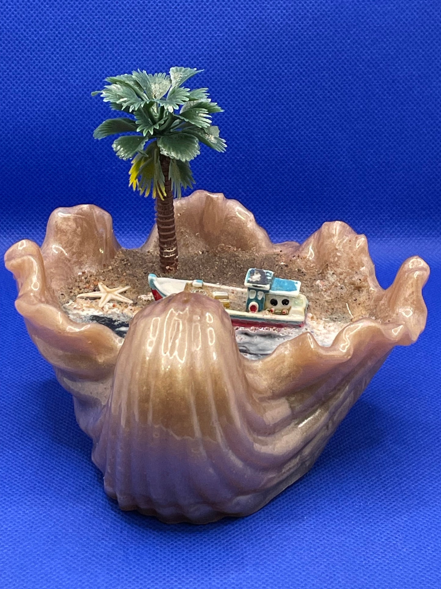 Sea shell with mini beach scene