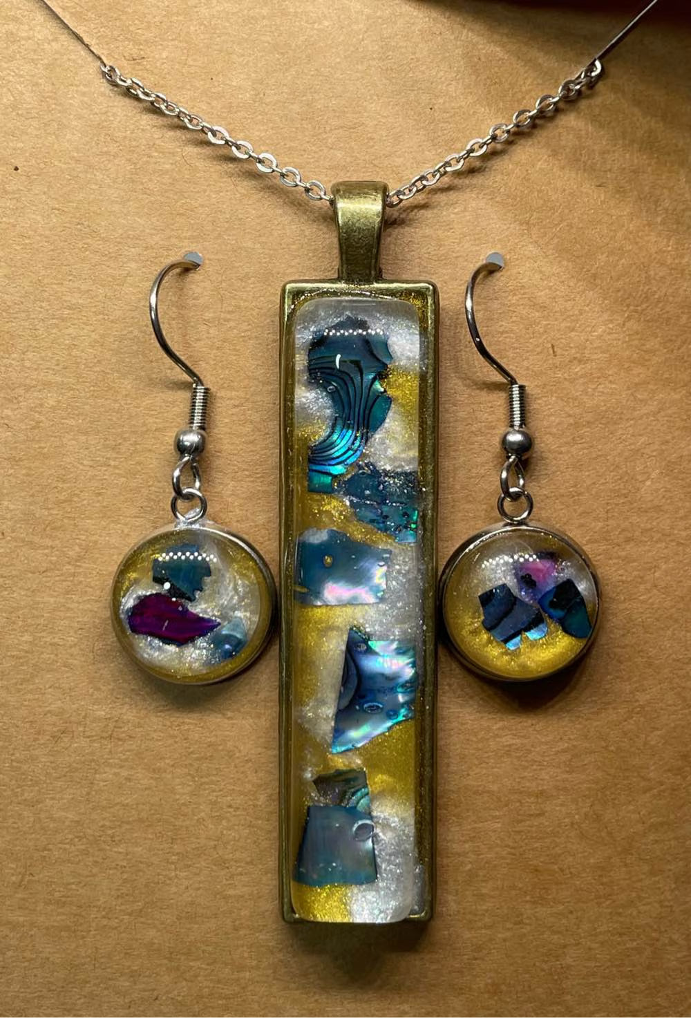 Blue/purple earrings and pendant set.