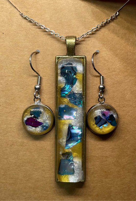 Blue/purple earrings and pendant set.