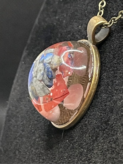 Mineral and abalone shell pendant.