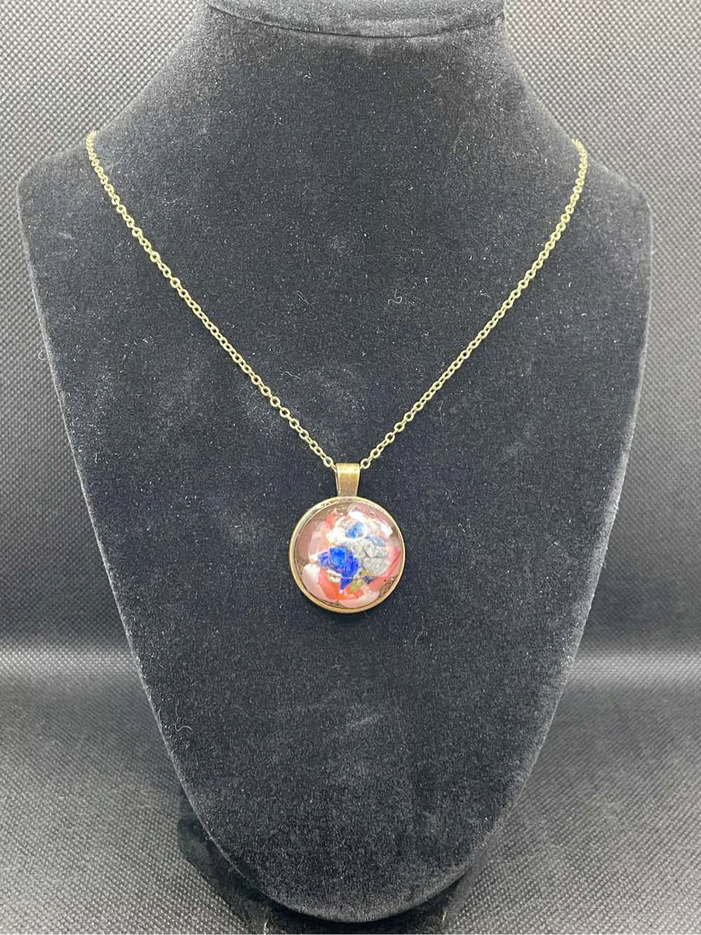 Mineral and abalone shell pendant.