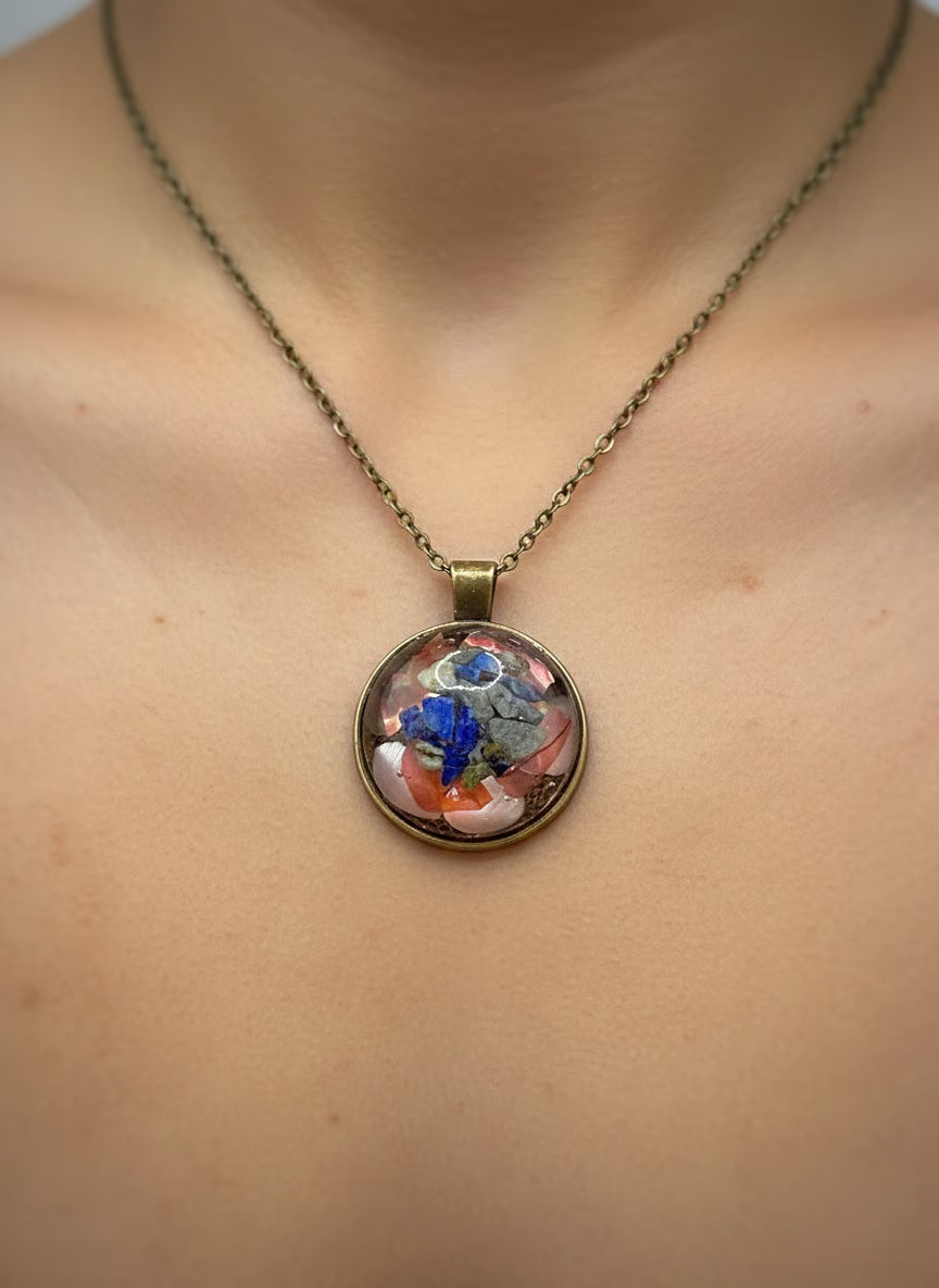 Mineral and abalone shell pendant.